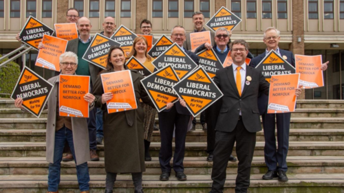 Local Libreral Democrats holding signs for the party as well as for the new local manifesto for 2026-2028