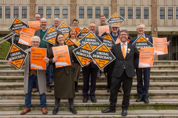Local Libreral Democrats holding signs for the party as well as for the new local manifesto for 2026-2028